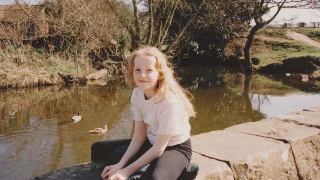A childhood portrait of Sarah Hart, illustrating the early years and experiences that shaped a passion for nature and beauty, later blossoming into a career in floristry, as detailed in the blog post.